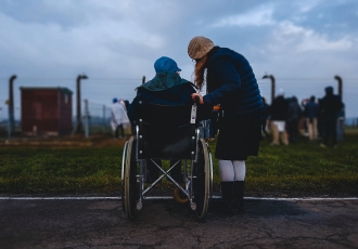 caregiver with person in wheelchair