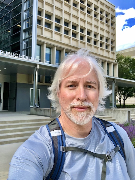 Dr. Knobloch in front of the College of Public Health (Cunz Hall)
