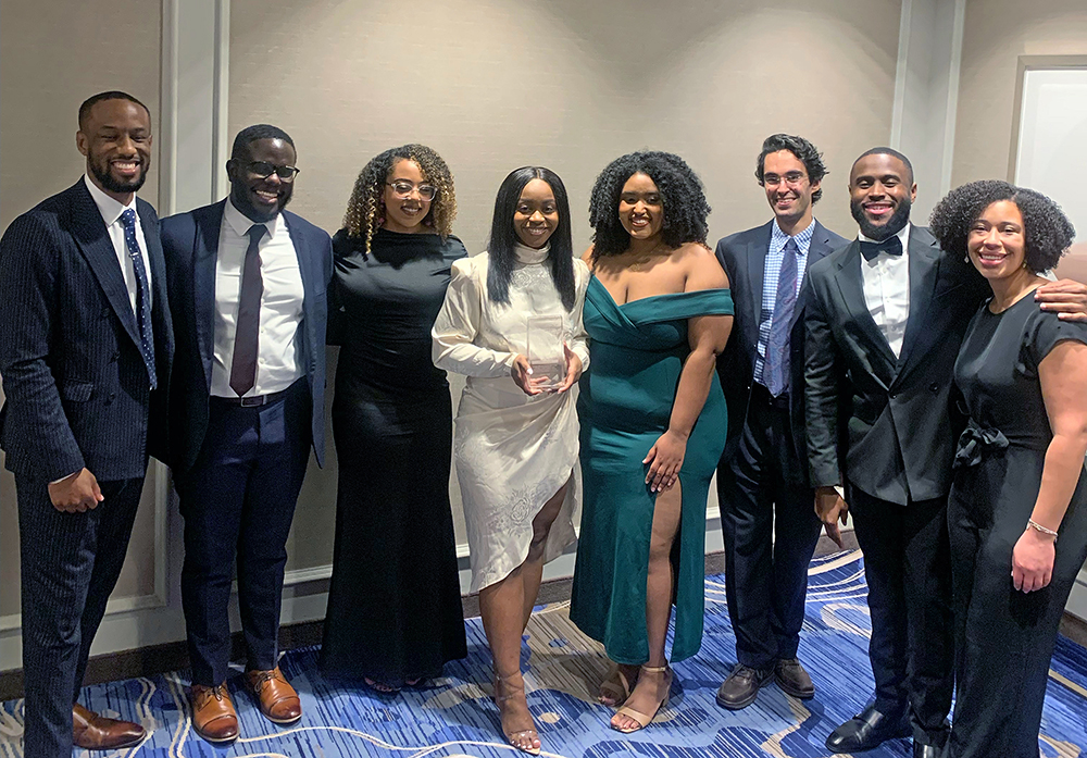 A group of people pose at the NAHSE Student Case Competition