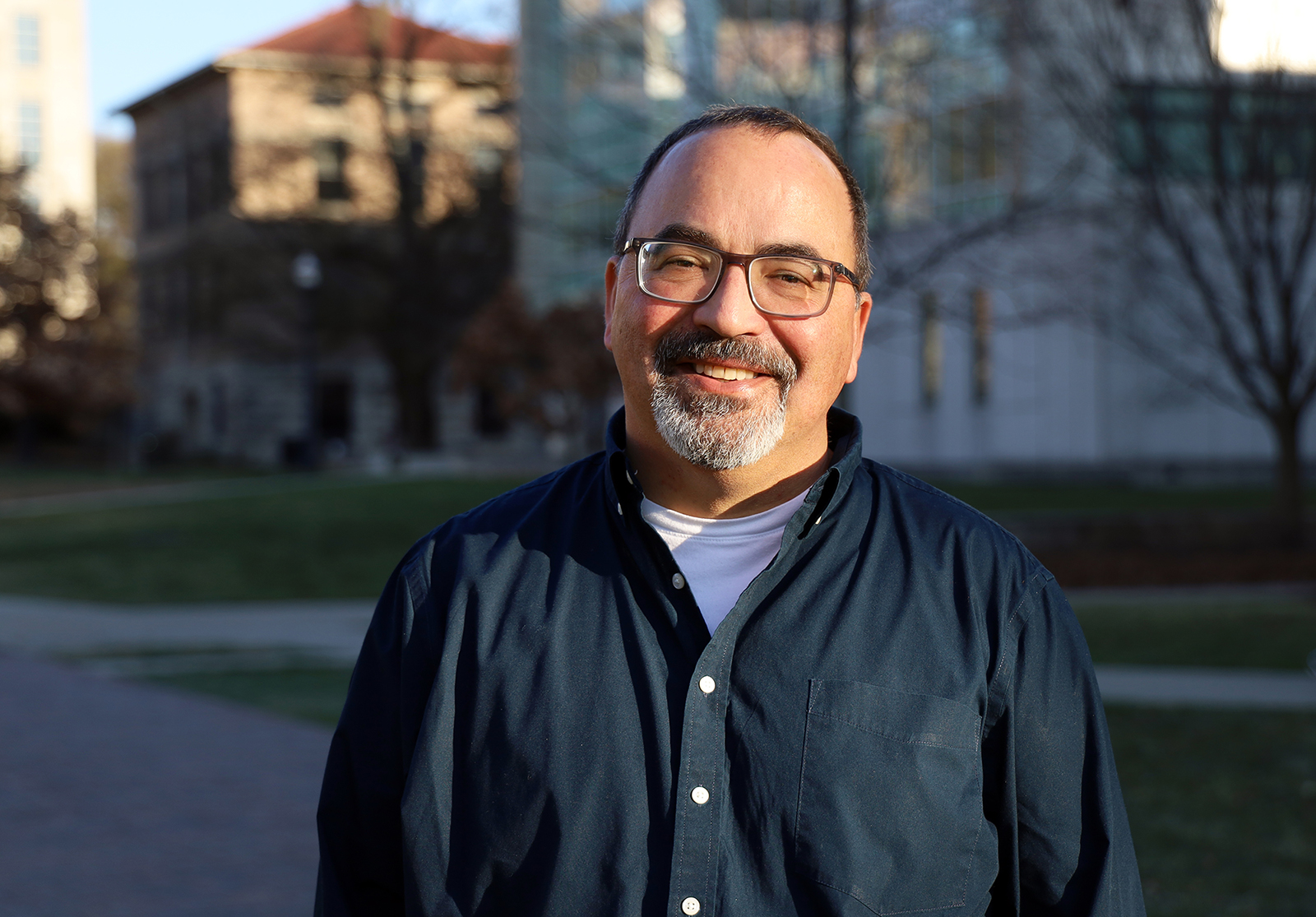 Paul Matherny smiling on sunny day by Cunz Hall