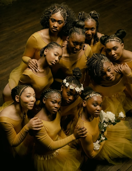 Black ballet dancers in costume in a group photo