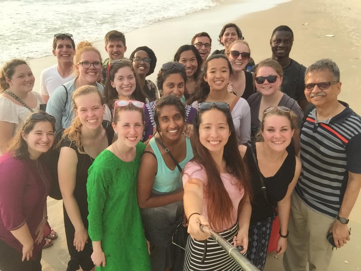 student group selfie on beach