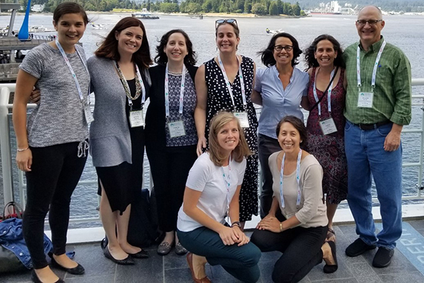 Bill Miller, top right, poses with Anna Cope, bottom left, and his other former students at the International Society for Sexually Transmitted Diseases Research biannual meeting in Vancouver in 2019.