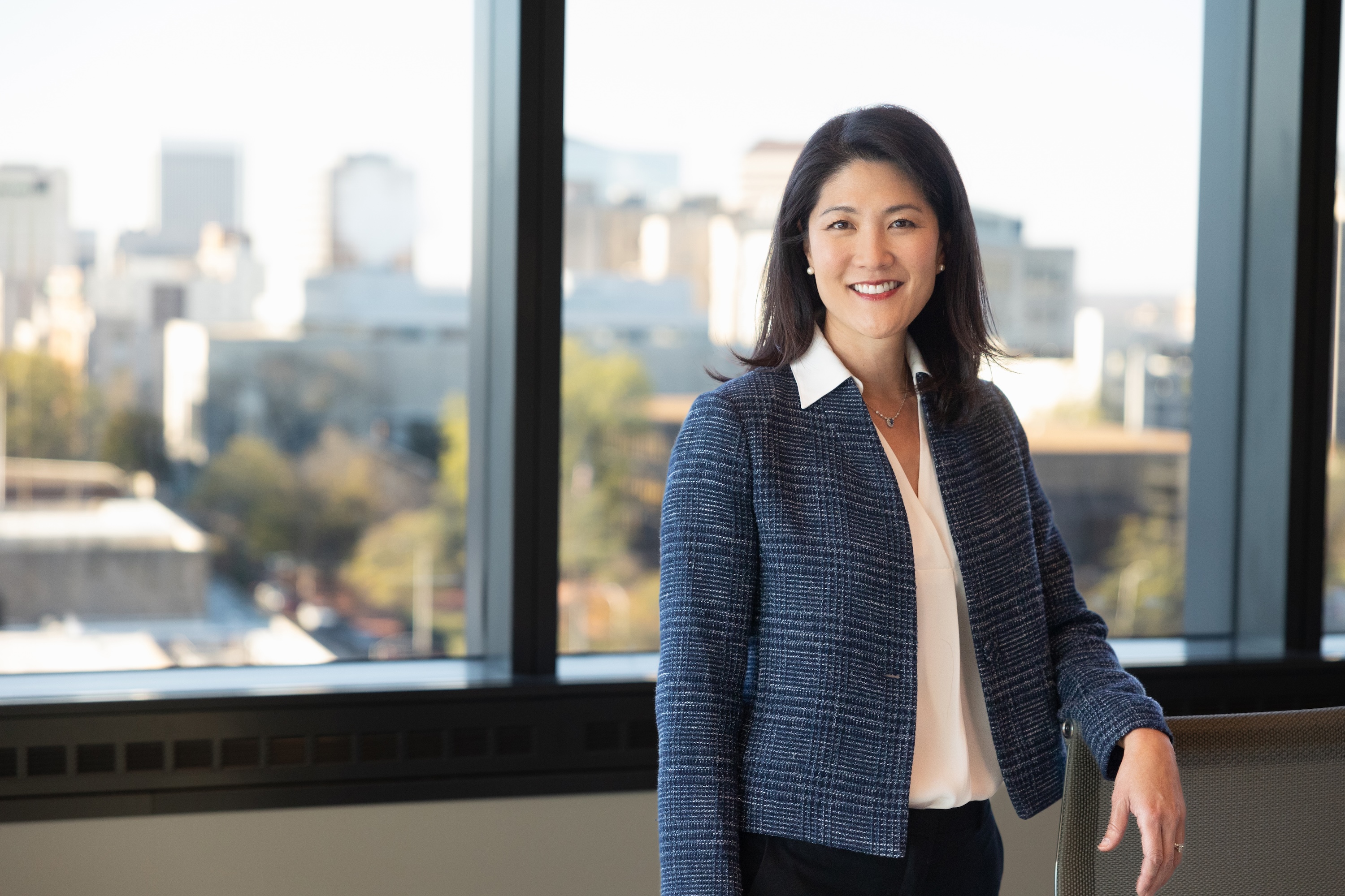 Dr. Paula Song stands by a window