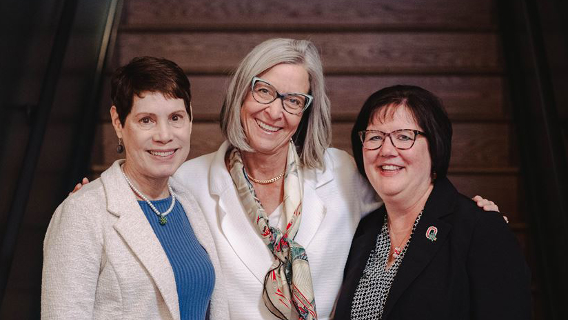 Sharon Schweikhart, Julie Robbins and Kelly Scheiderer smile for a photo