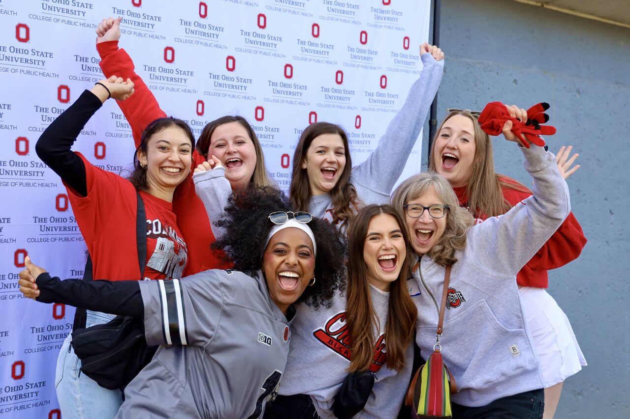 students pose for a photo with Amy Ferketich