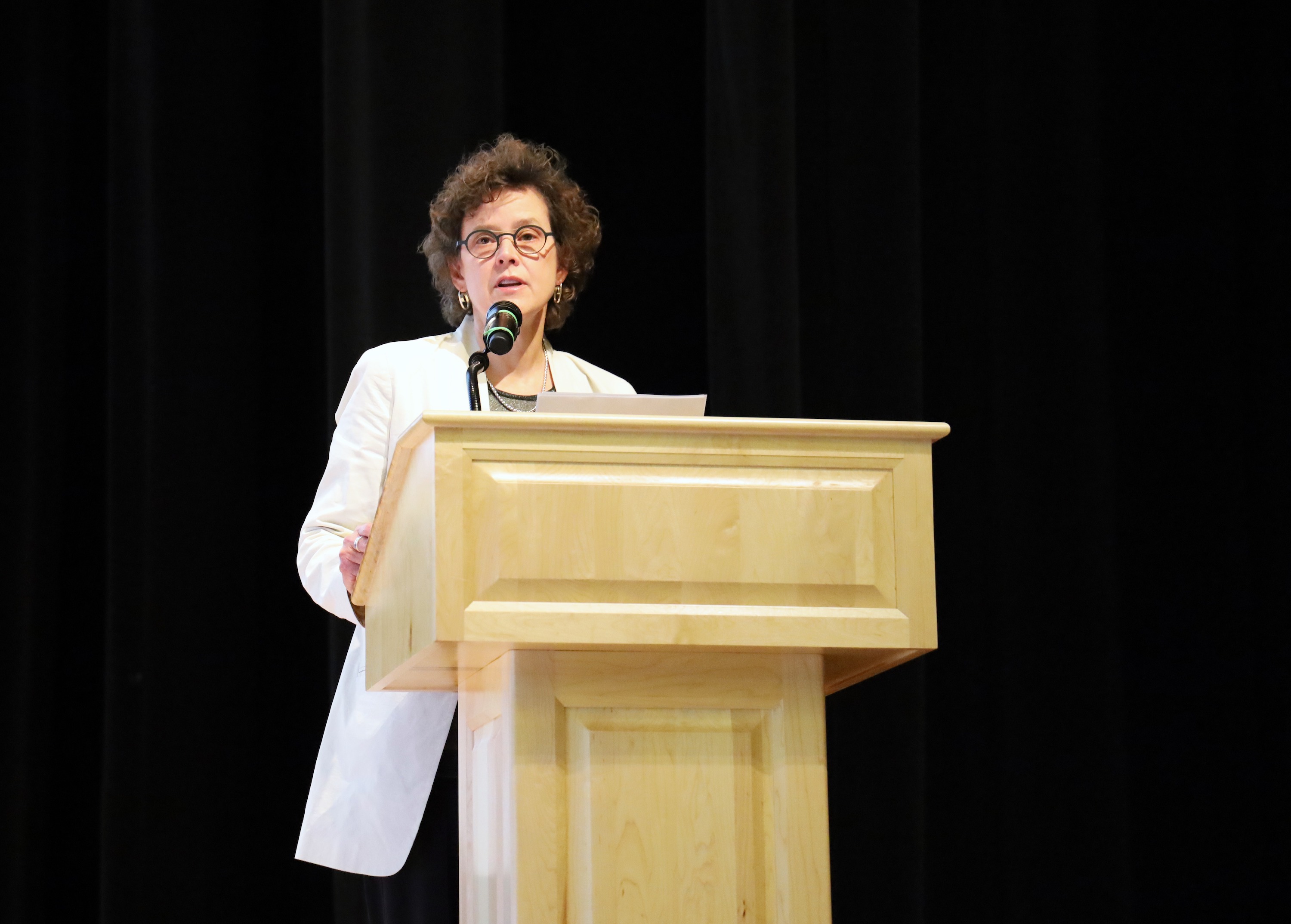 Dean Amy Fairchild at podium