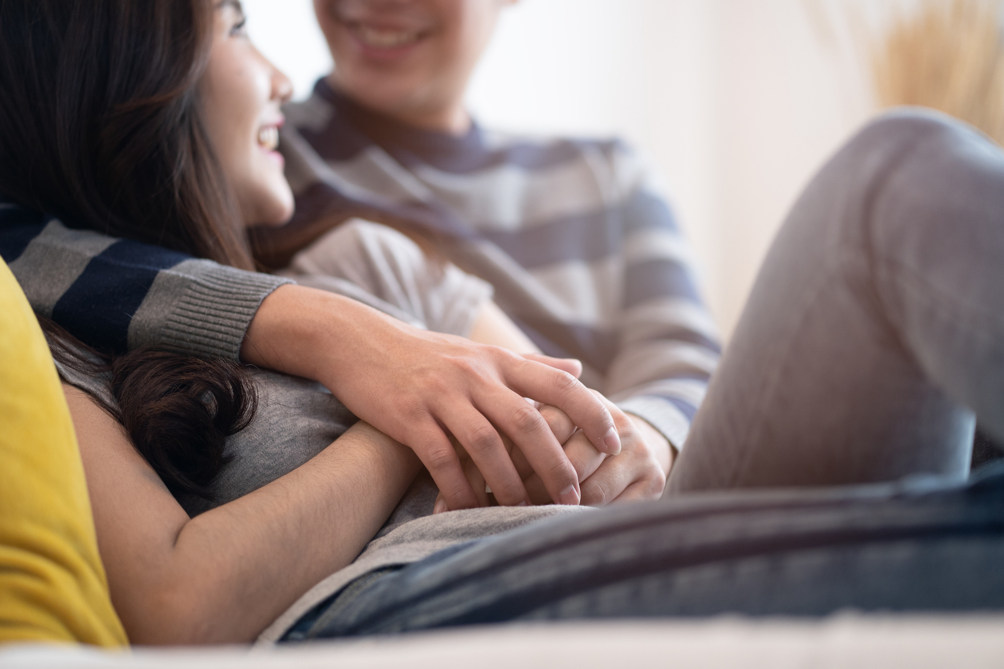 Couple on couch hugging