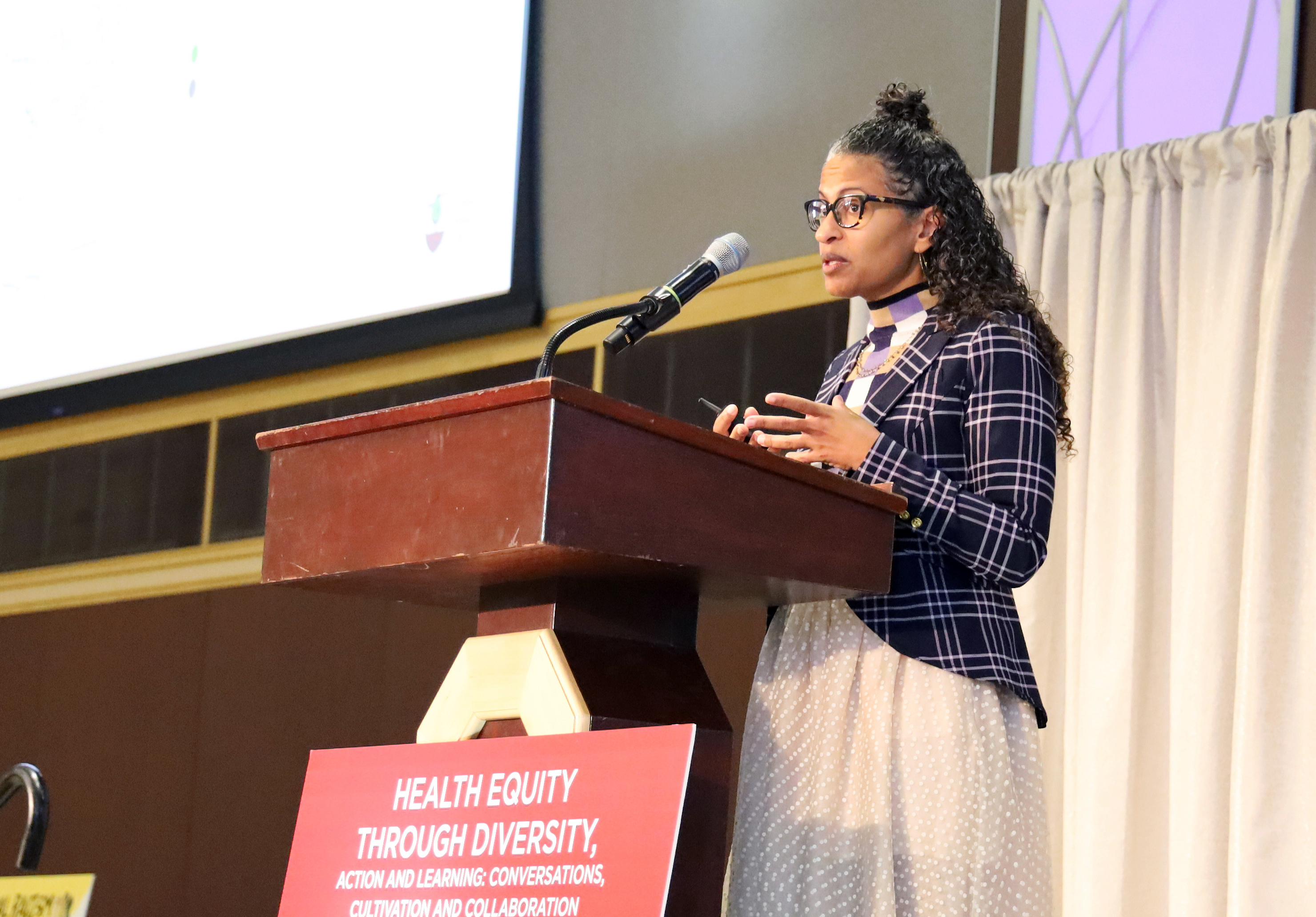 Eugenia South speaks behind a lectern