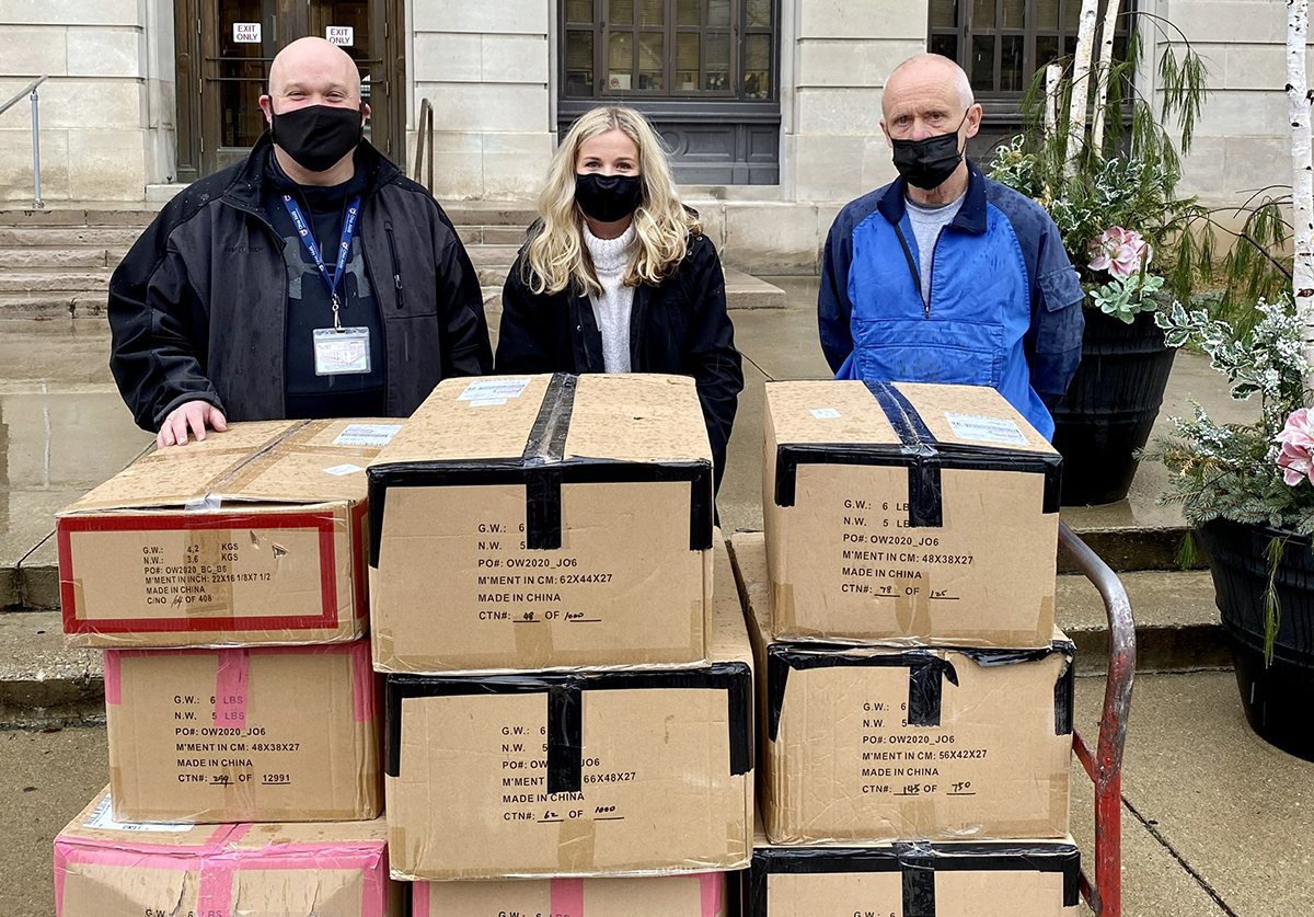 PHSLC President Madison Conley (center) delivers coats with Scioto County probation officers Jason Johnson (left) and Chuck Law (right).