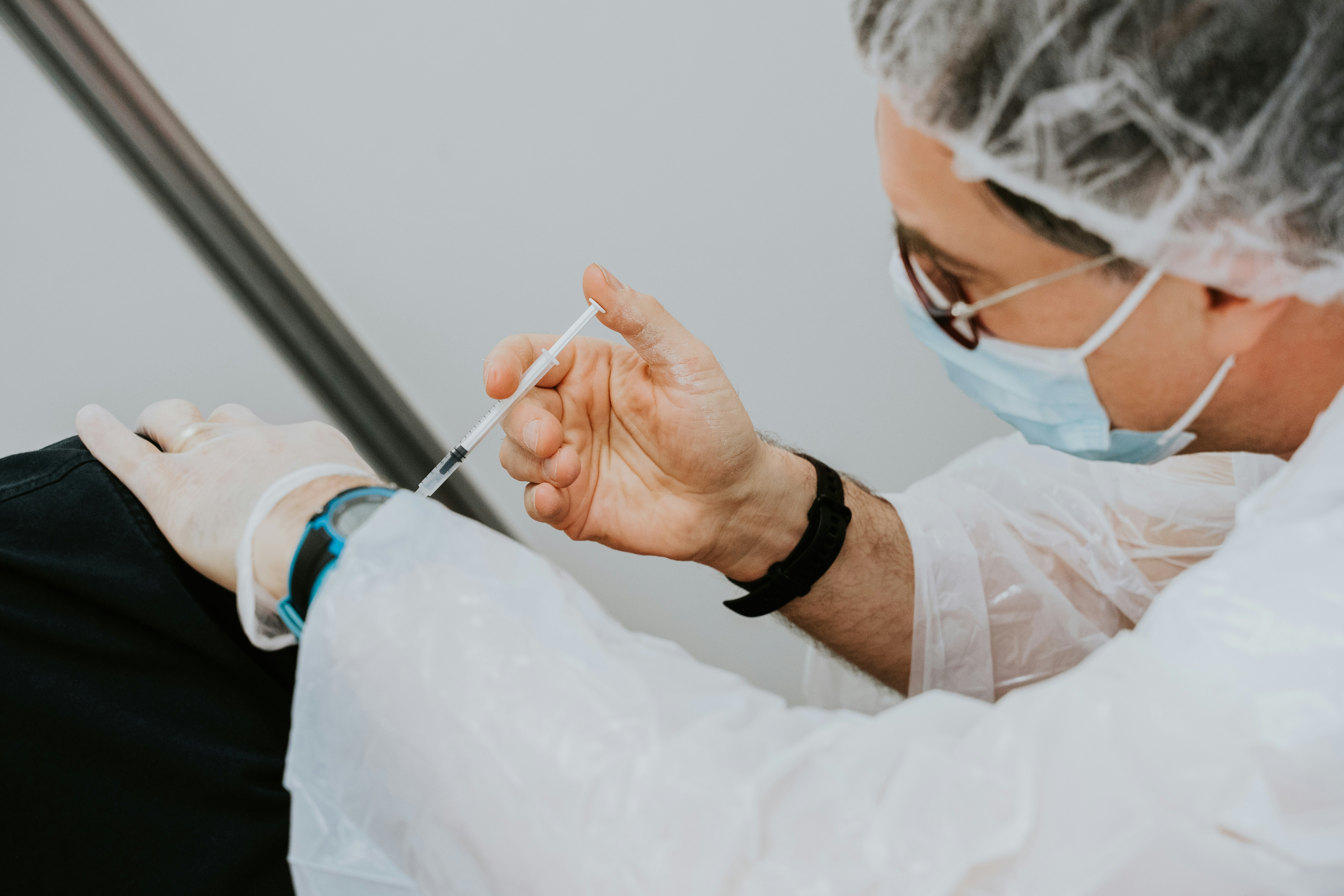 A health care provider administers a vaccine.