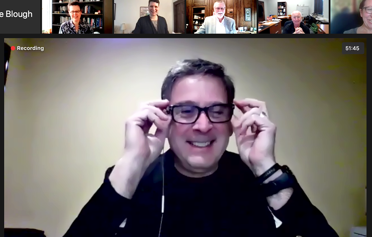 Mike Bisesi spotlit in a zoom meeting with university leadership