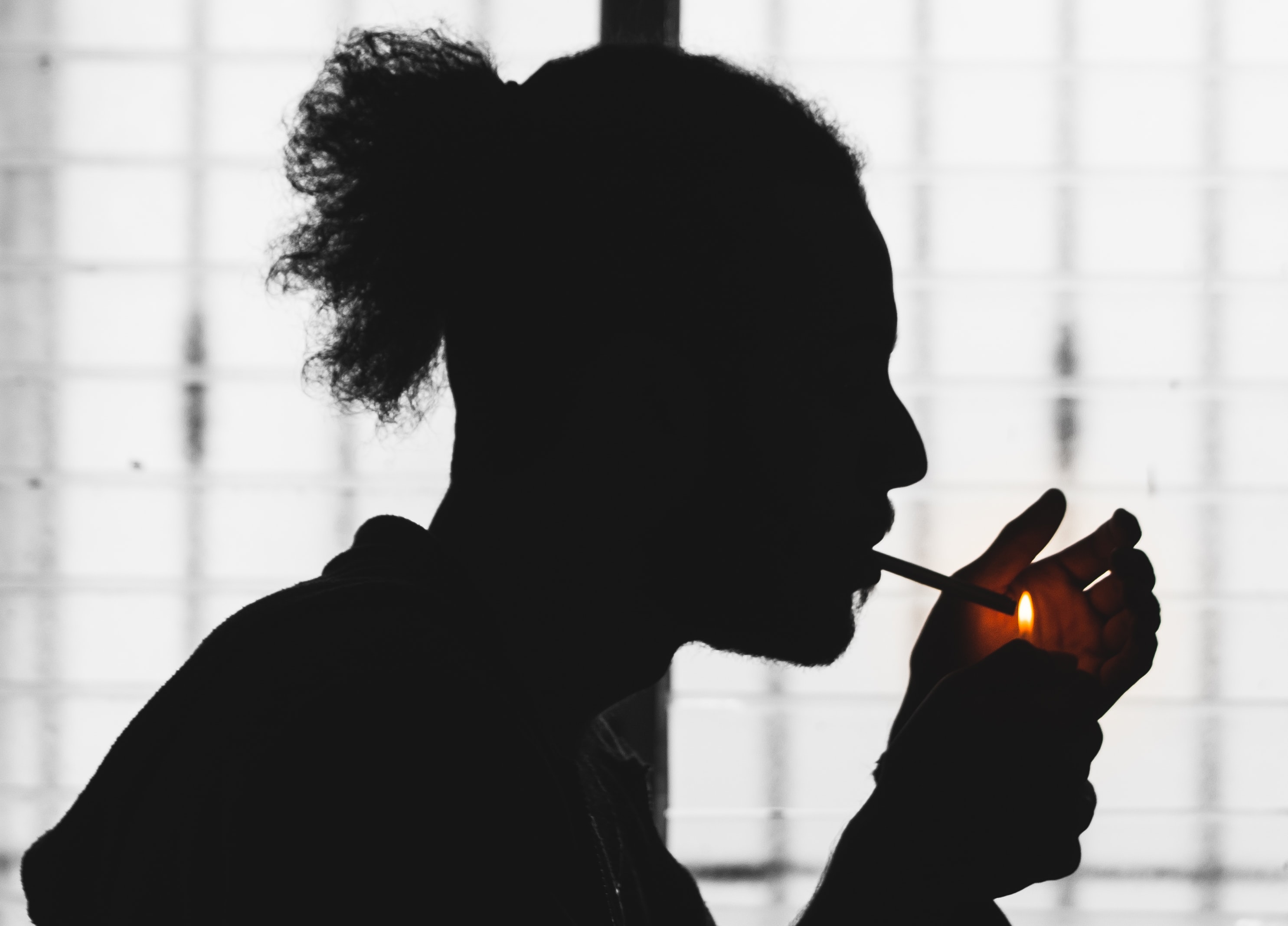 Young man smoking a cigarette