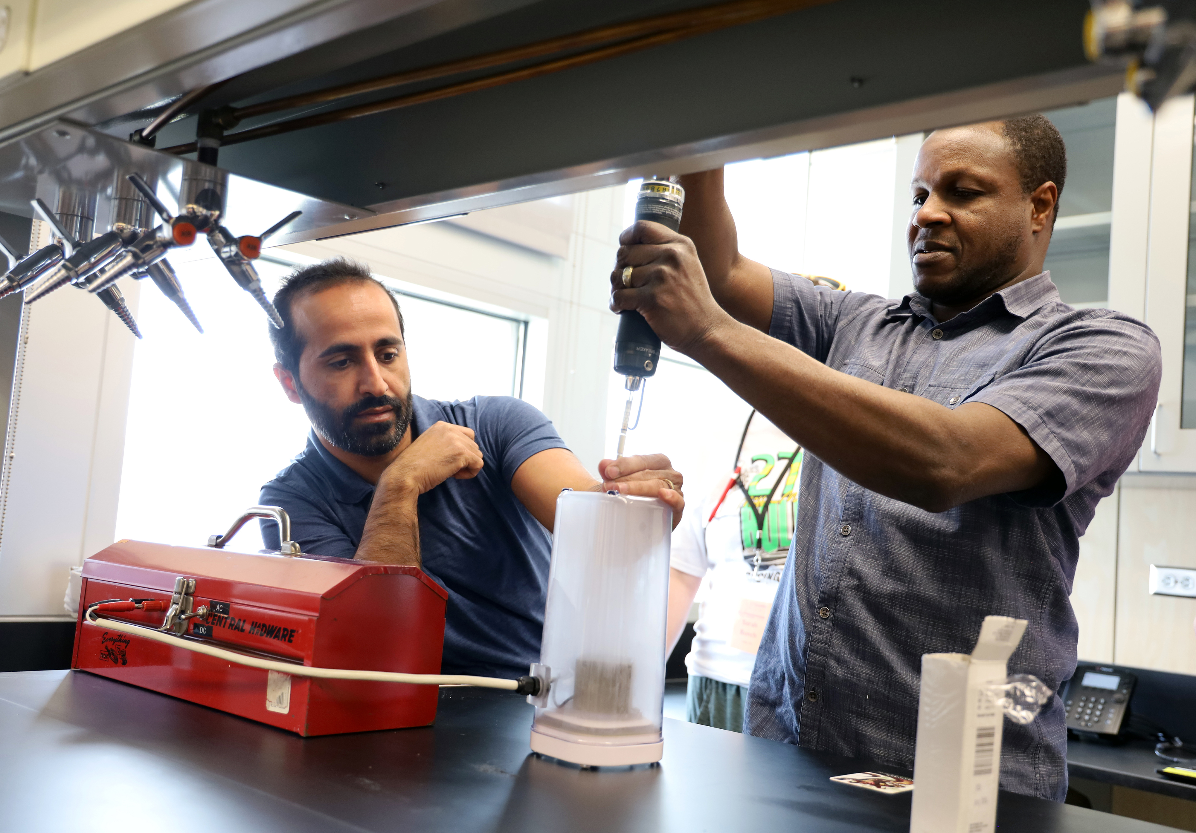 Ahmad El Hellani and Olorunfemi Adetona do a demonstration for teachers during the STEAMM Rising Institute.