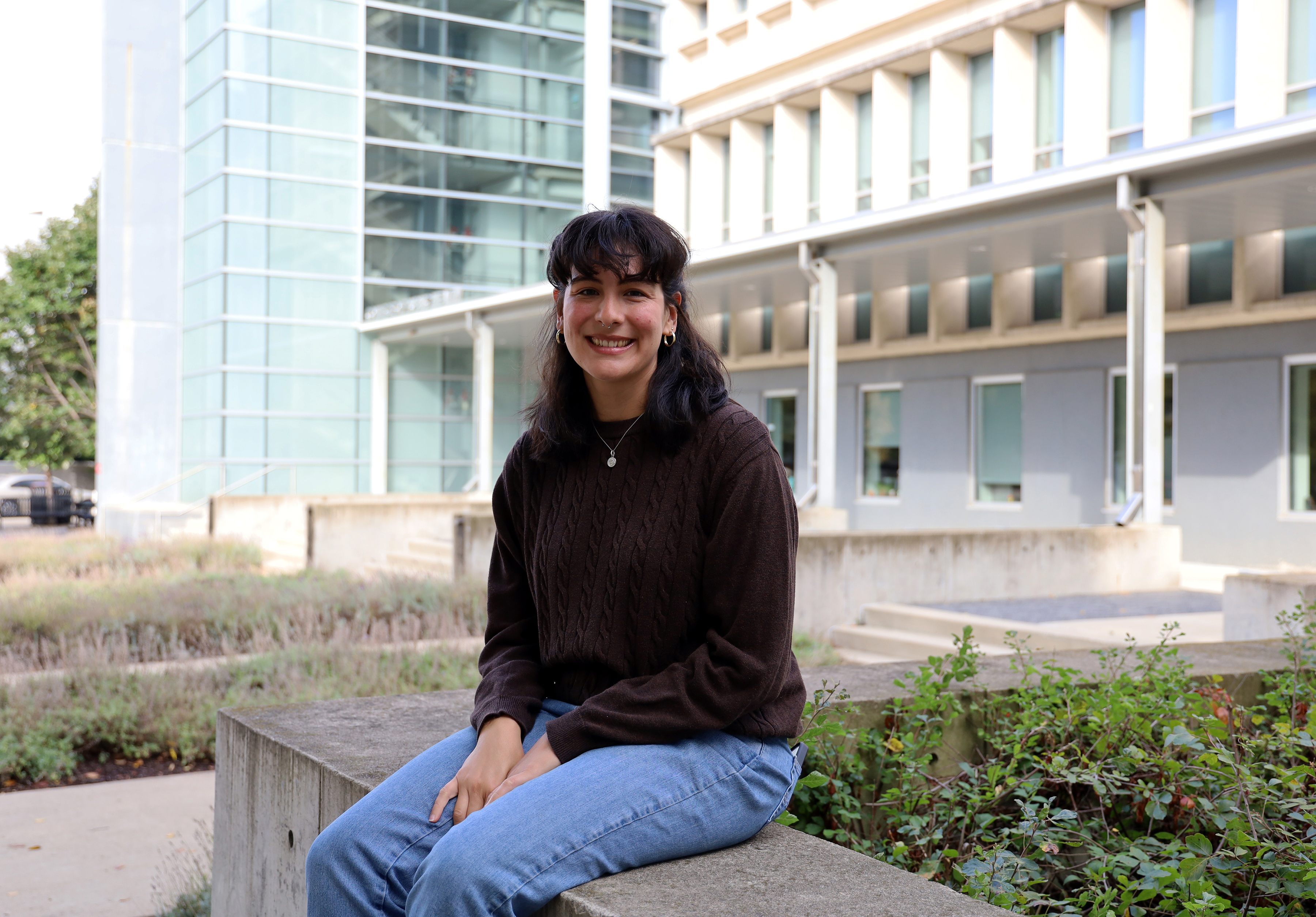 Micaela Richter smiles for a photo in front of Cunz Hall.