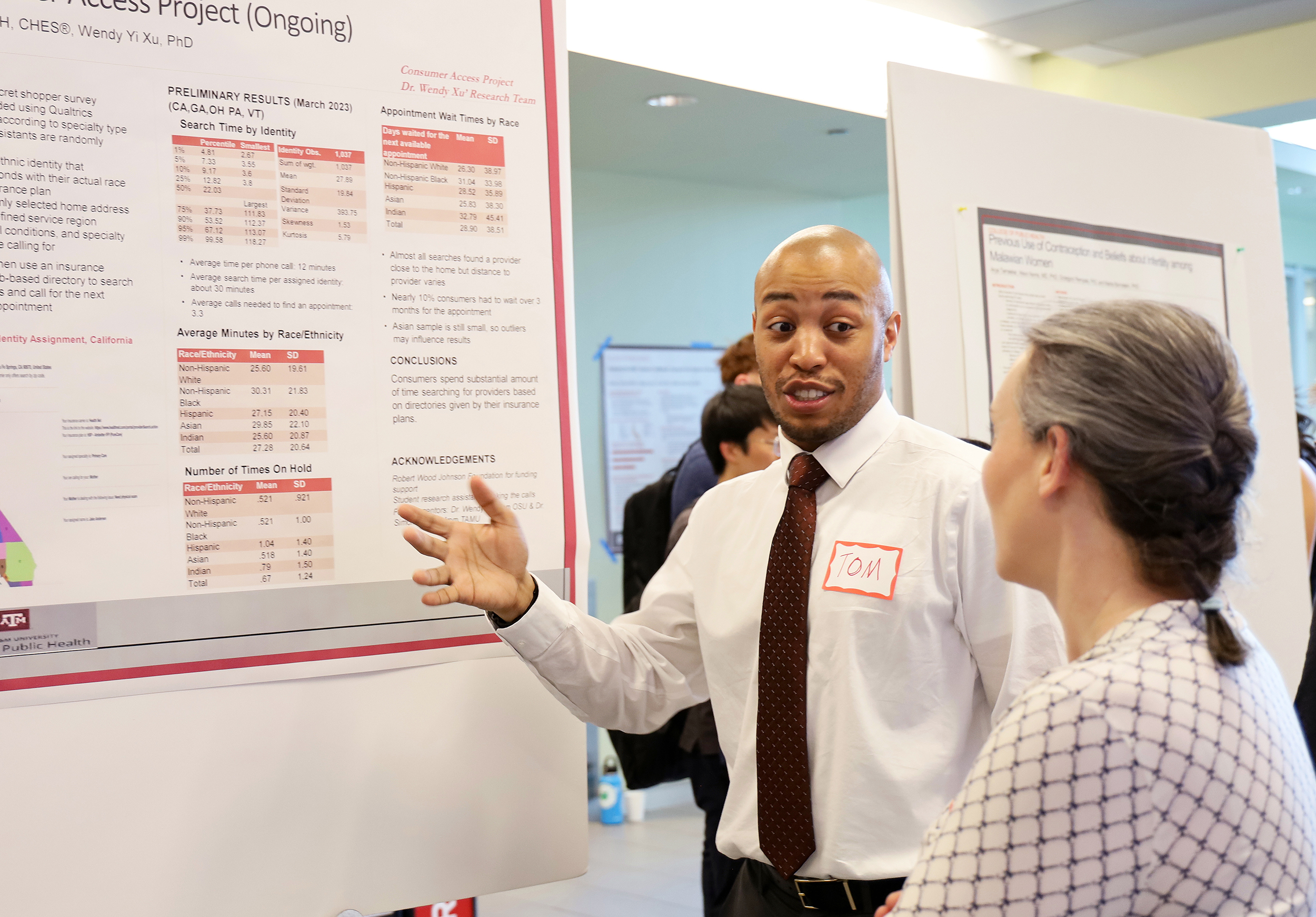 Thomas Elton presents a poster during CPH Poster Day
