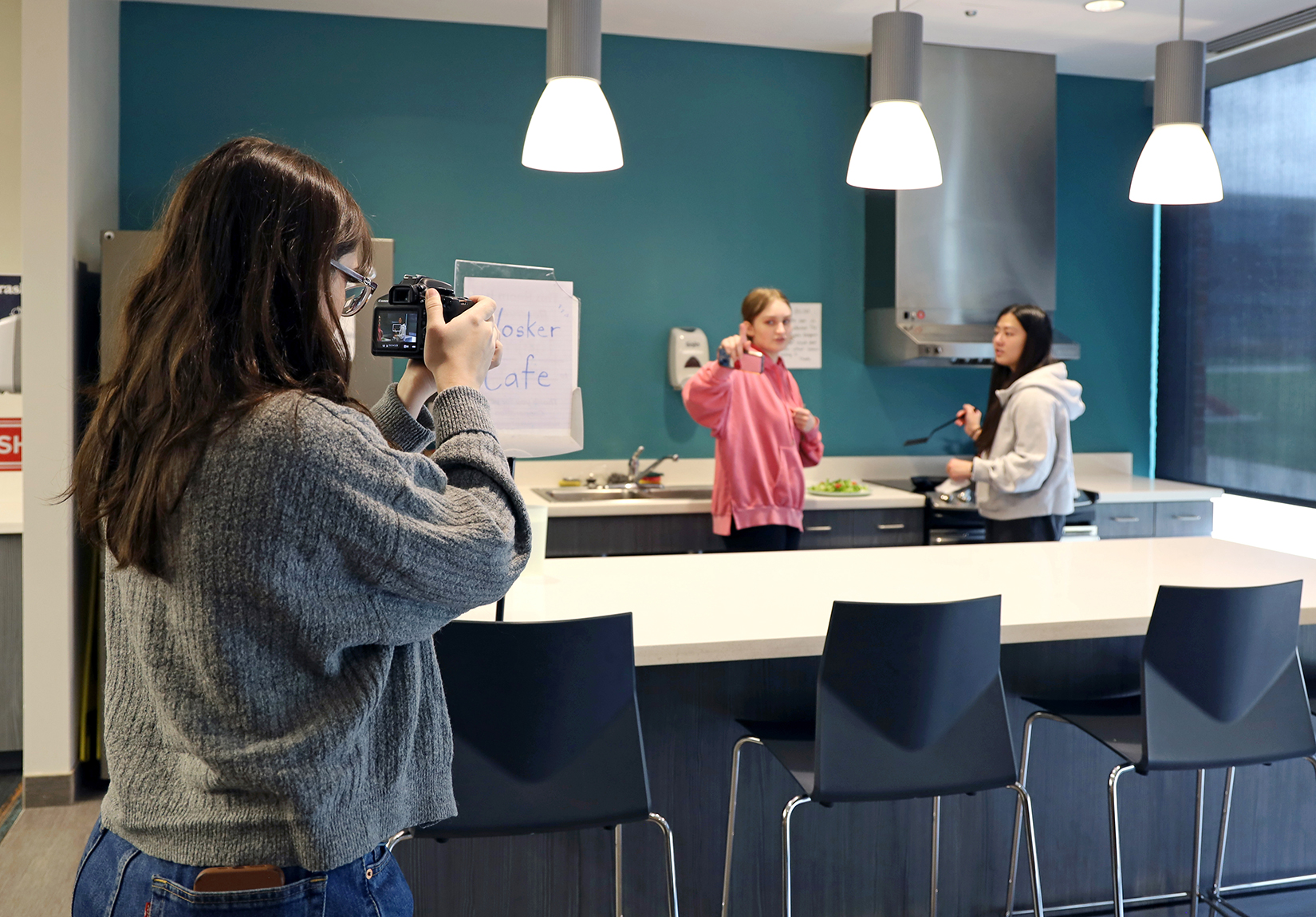 one student films while two provide direction