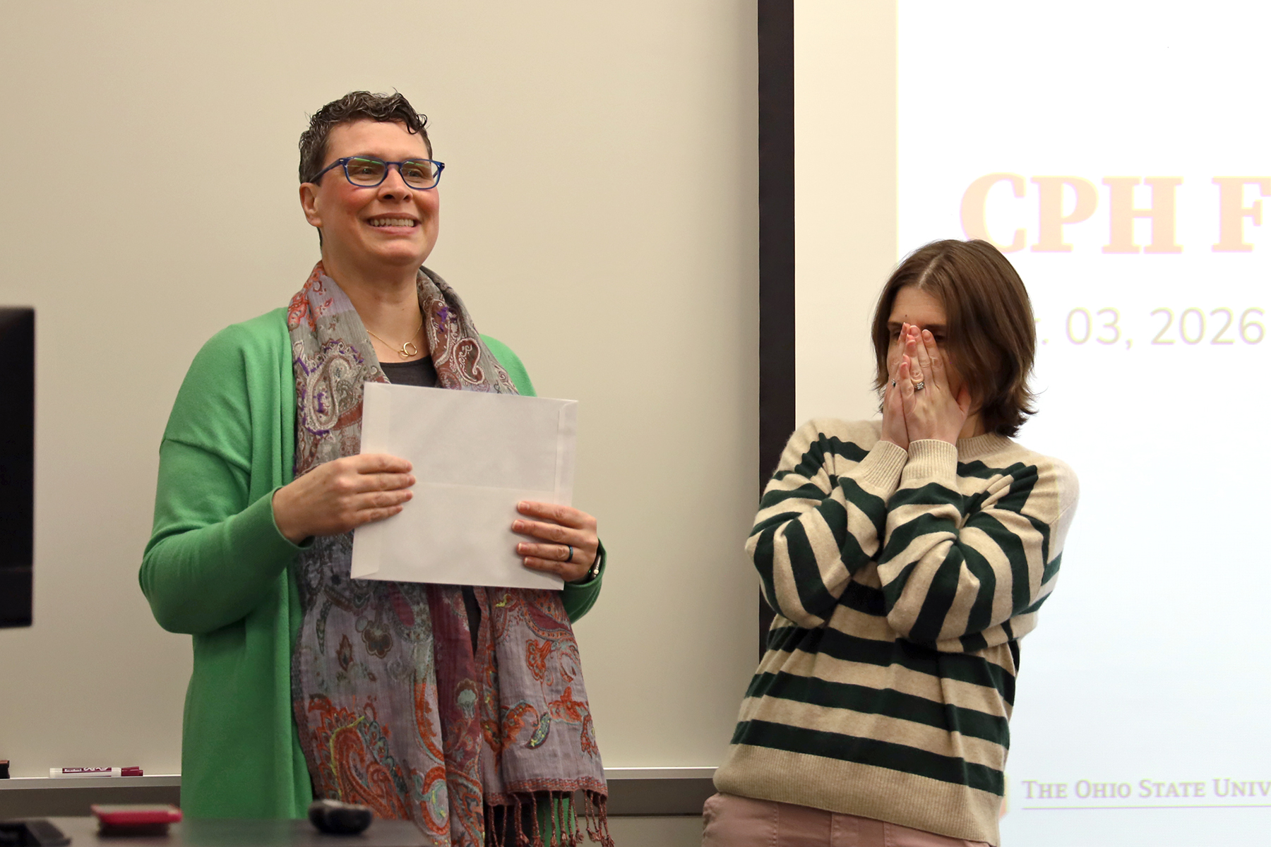 One woman looks surprised while another speaks