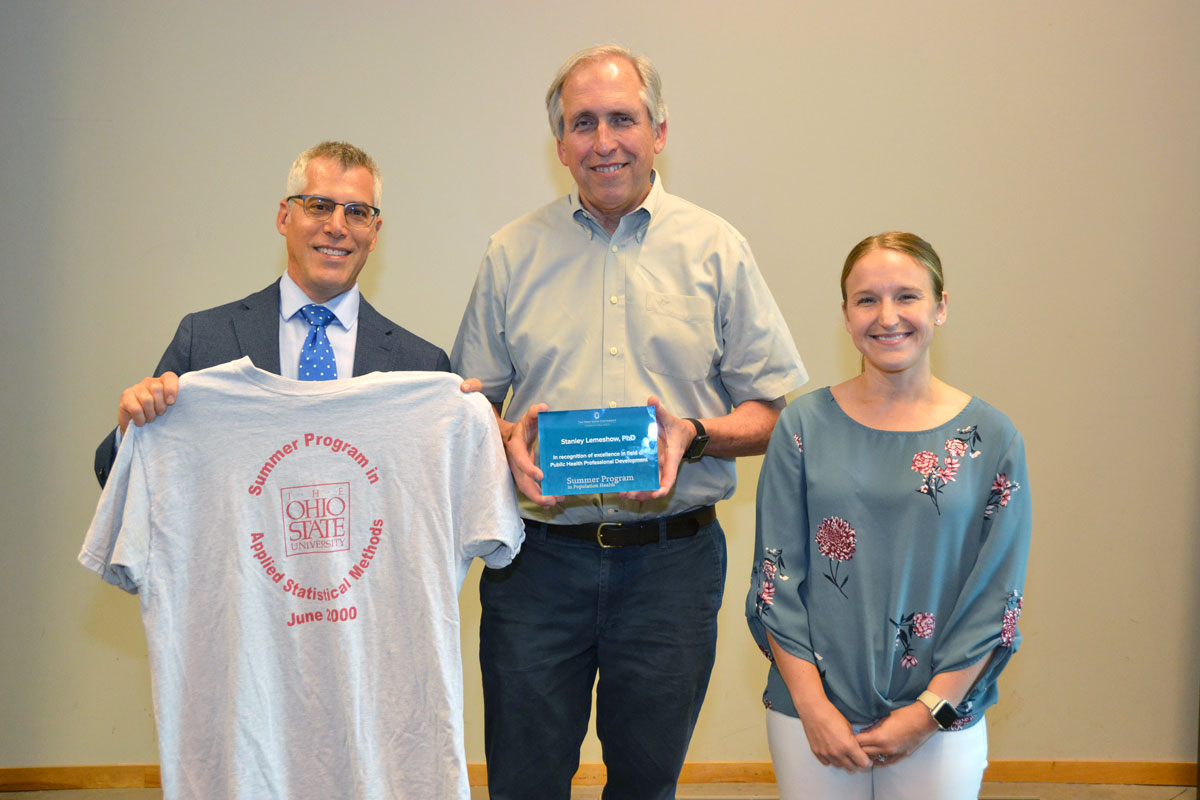 Stanley Lemeshow (center), professor of biostatistics and founding dean of CPH, received an award by CPHP director Andy Wapner and program manager Colleen Fitzgibbons.