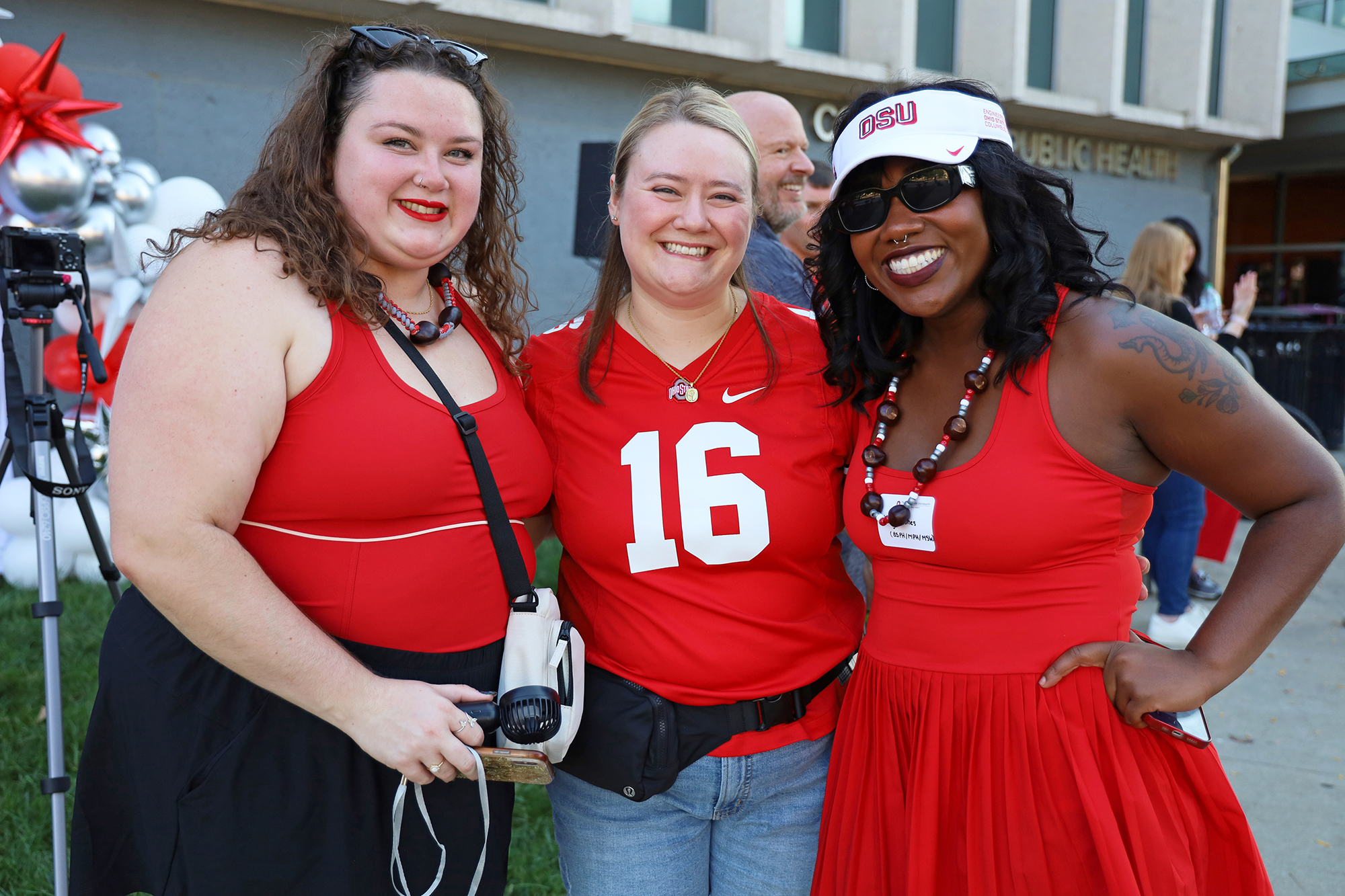 three people pose outside Cunz Hall
