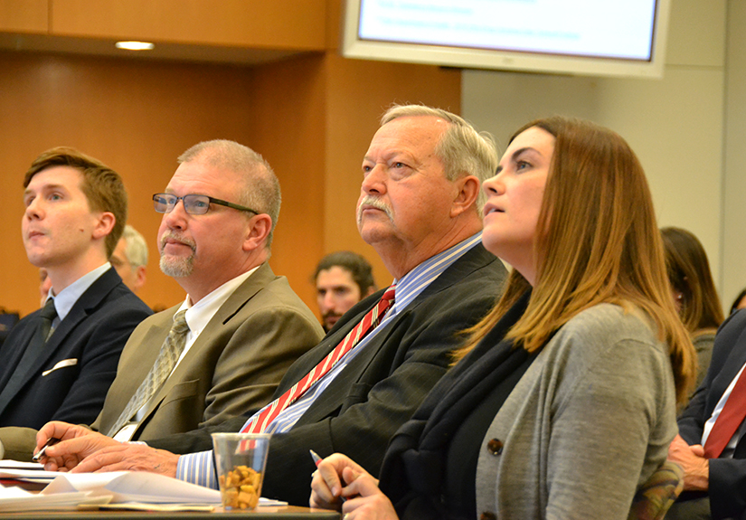 CPH alumnus Zeb Purdin (left), one of the competition's organizers, sits beside the panel of judges (from left): Doug Fisher, DPM, health commissioner of Hocking County; Bill Dunlap, deputy director of the Athens-Hocking-Vinton Alcohol, Drug Addiction and Mental Health Services Board; and Kathryn Lancaster, PhD, MPH, assistant professor of epidemiology at CPH.