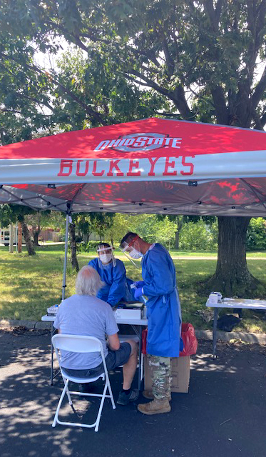 Ohio National Guard medics administer a COVID-19 test at Davidson High School. 