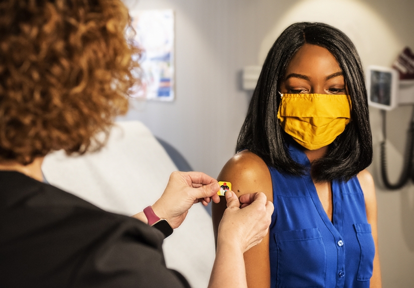 woman of color at vaccination appointment