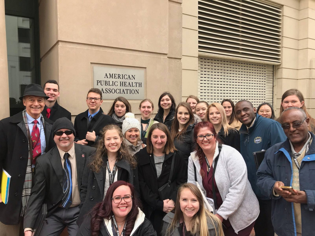 Dean Martin II, MD and College of Public Health students pose after visiting the American Public Health Association.