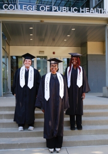 Billan Gurreh, Viviana Gomez, and Tinu Ijewemen in front of Cunz Hall