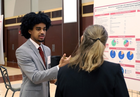 Emanuel Tewolde shares his research poster on March 4.