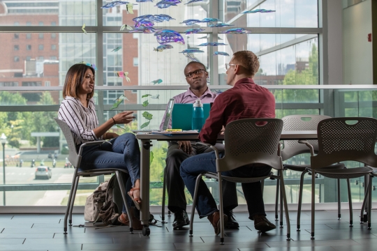 students sitting and talking at a table