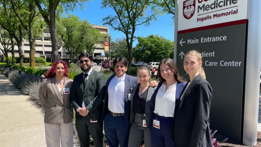 Administrative residency students stand in front of the UChicago Medicine sign