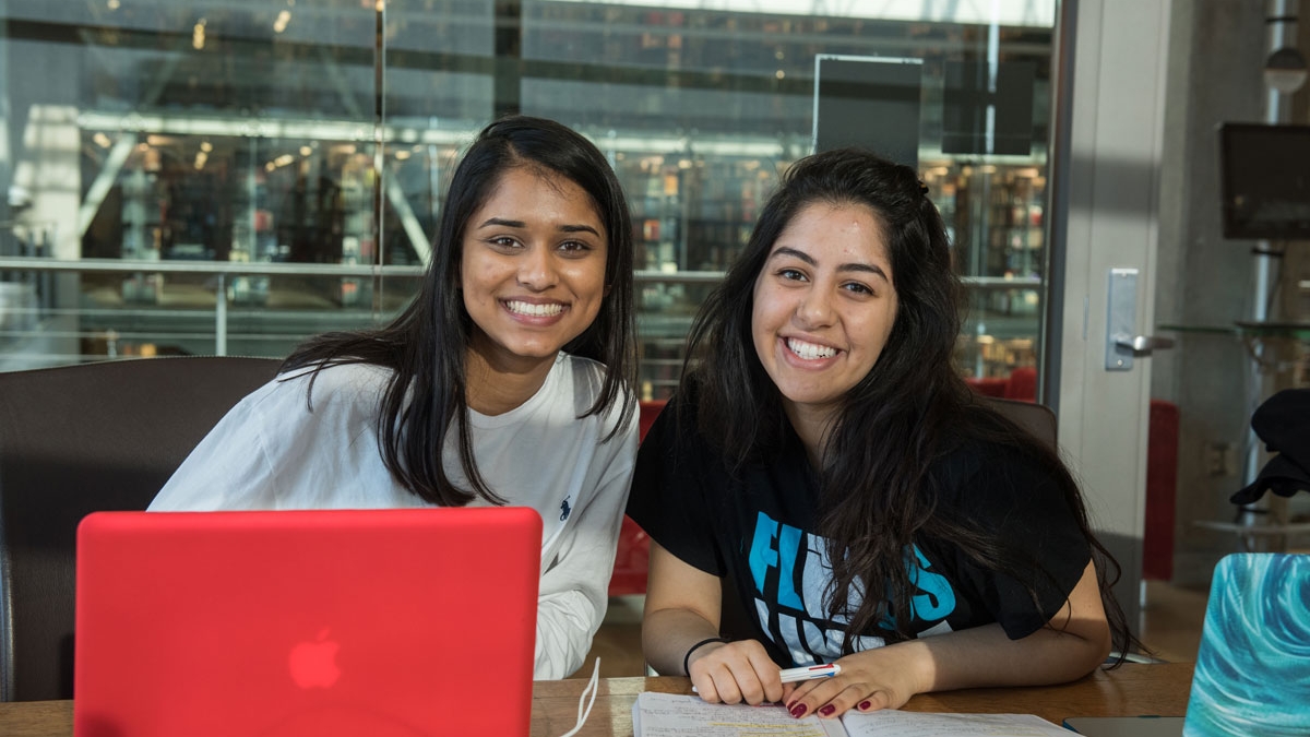 Two young women in a study room at Ohio State's Thompson Library