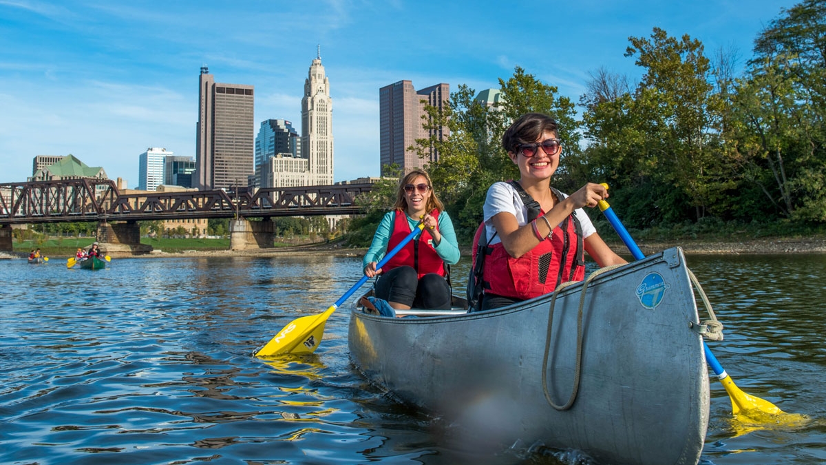 Two students in a canoe on the Scioto River in Columbus, Ohio