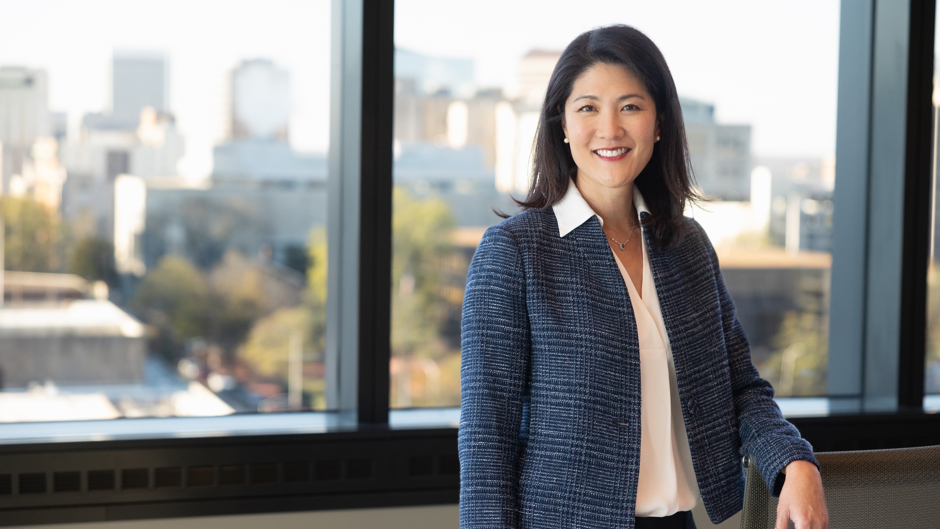 Dr. Paula Song stands by a window