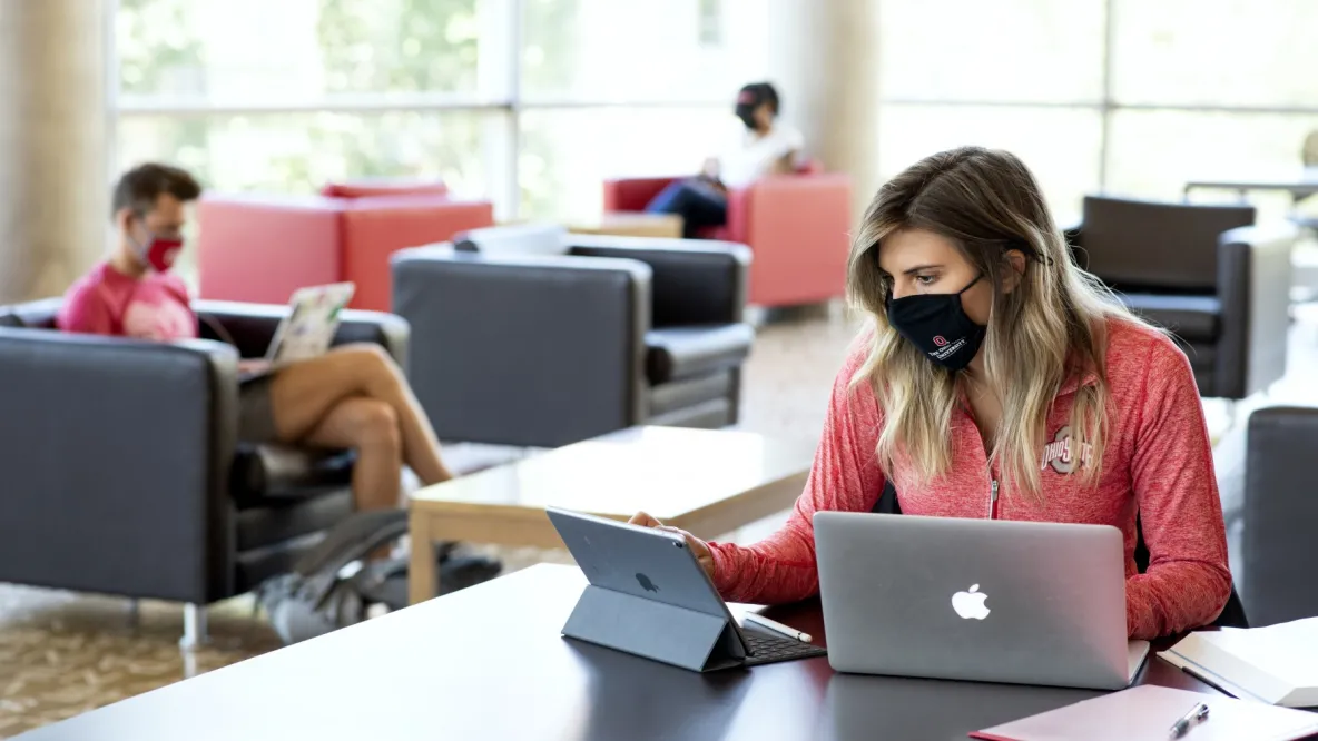 students wearing masks in library