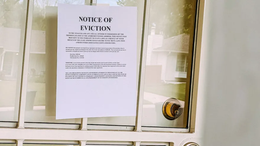Eviction notice posted on a closed door