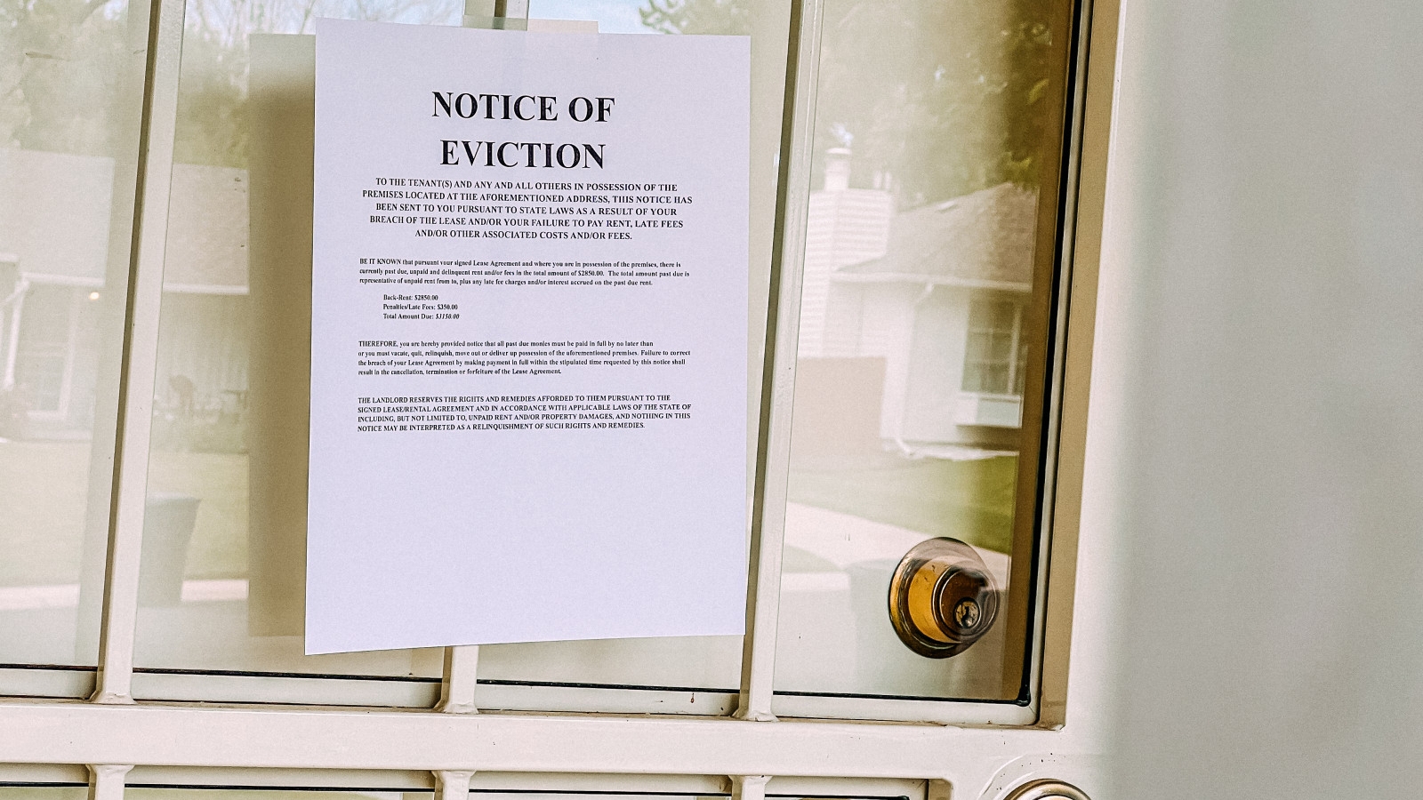 Eviction notice posted on a closed door