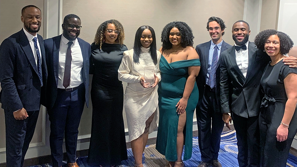A group of people pose at the NAHSE Student Case Competition
