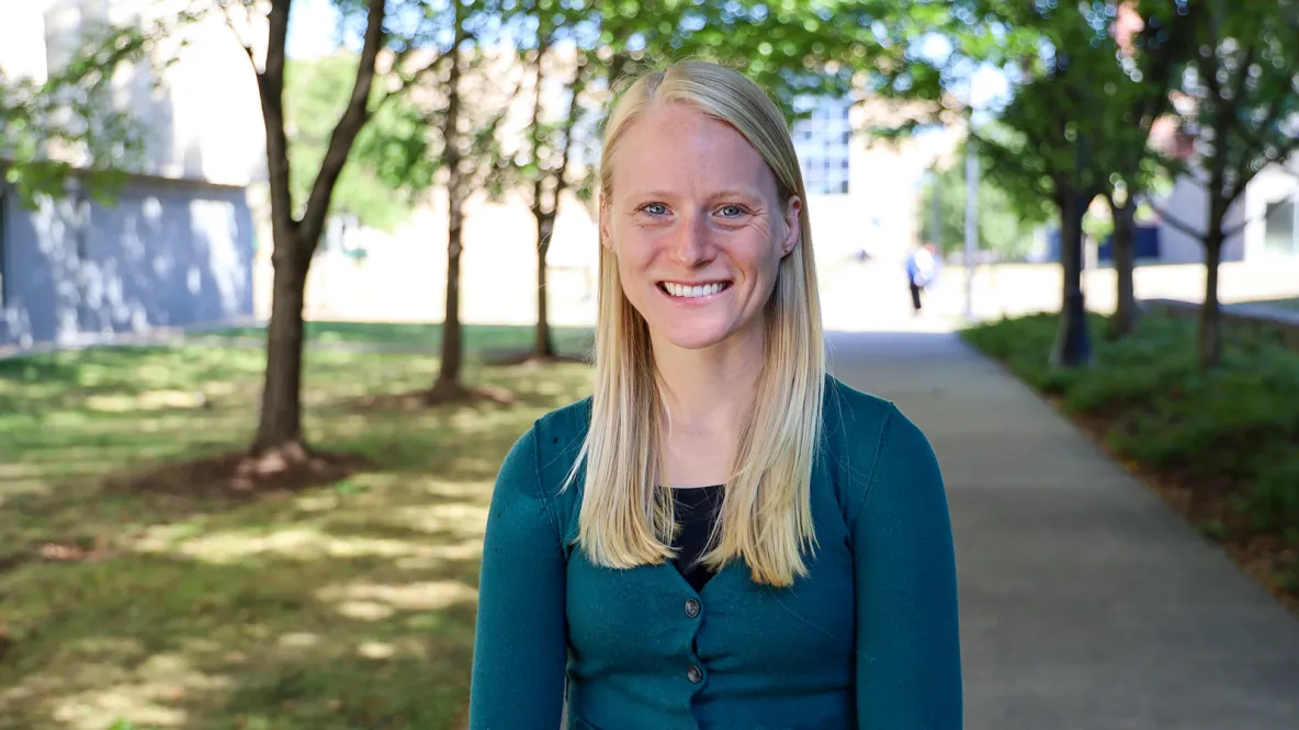 Arbor Quist smiles outside Cunz Hall.