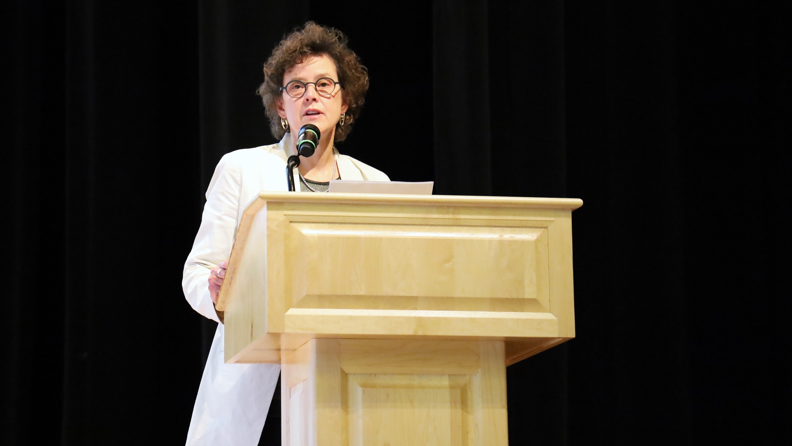 Dean Amy Fairchild at podium