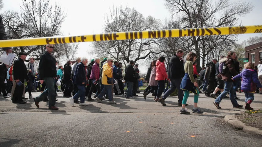 CHICAGO, IL - APRIL 14: Marchers, led by Cardinal Blase Cupich, walk through the Englewood neighborhood calling for an end to the violence that has plagued the city on April 14, 2017 in Chicago, Illinois. The marchers stopped several times to reflect on the Stations of the Cross and to read out the names of Chicago homicide victims. With 14 homicides so far in 2017, Englewood is one of the most violent neighborhoods in the city. (Photo by Scott Olson/Getty Images)