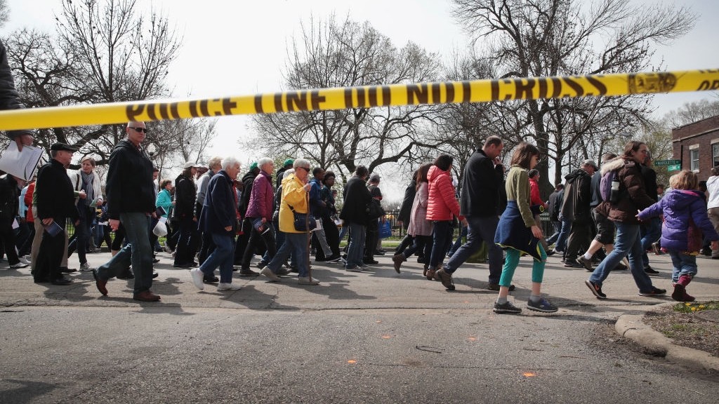 CHICAGO, IL - APRIL 14: Marchers, led by Cardinal Blase Cupich, walk through the Englewood neighborhood calling for an end to the violence that has plagued the city on April 14, 2017 in Chicago, Illinois. The marchers stopped several times to reflect on the Stations of the Cross and to read out the names of Chicago homicide victims. With 14 homicides so far in 2017, Englewood is one of the most violent neighborhoods in the city. (Photo by Scott Olson/Getty Images)