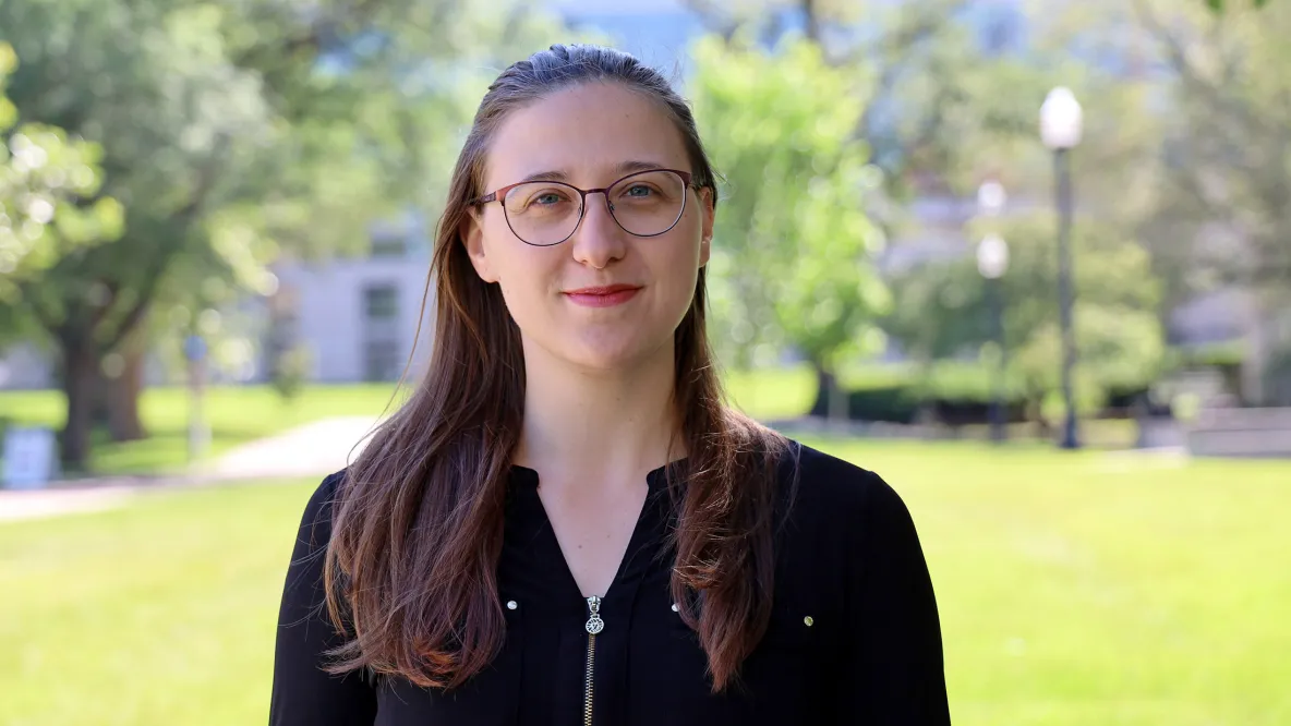 Fernanda Schumacher outside with Thompson Library in the background.