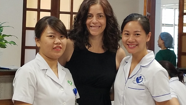 Maria Gallo, PhD, with health care team at Hanoi Hospital in Vietnam.