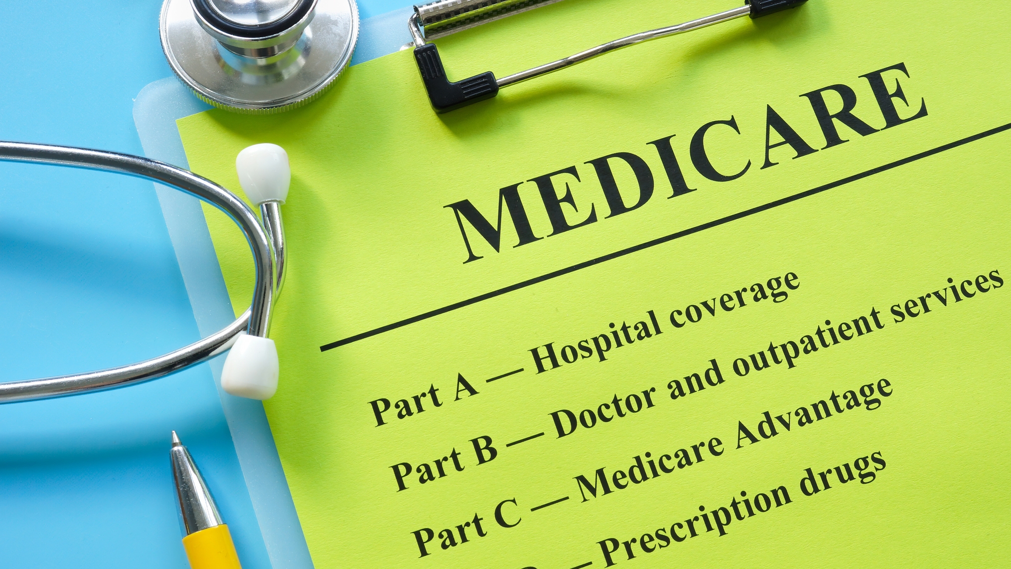 Green paper that says Medicare with a blue background.