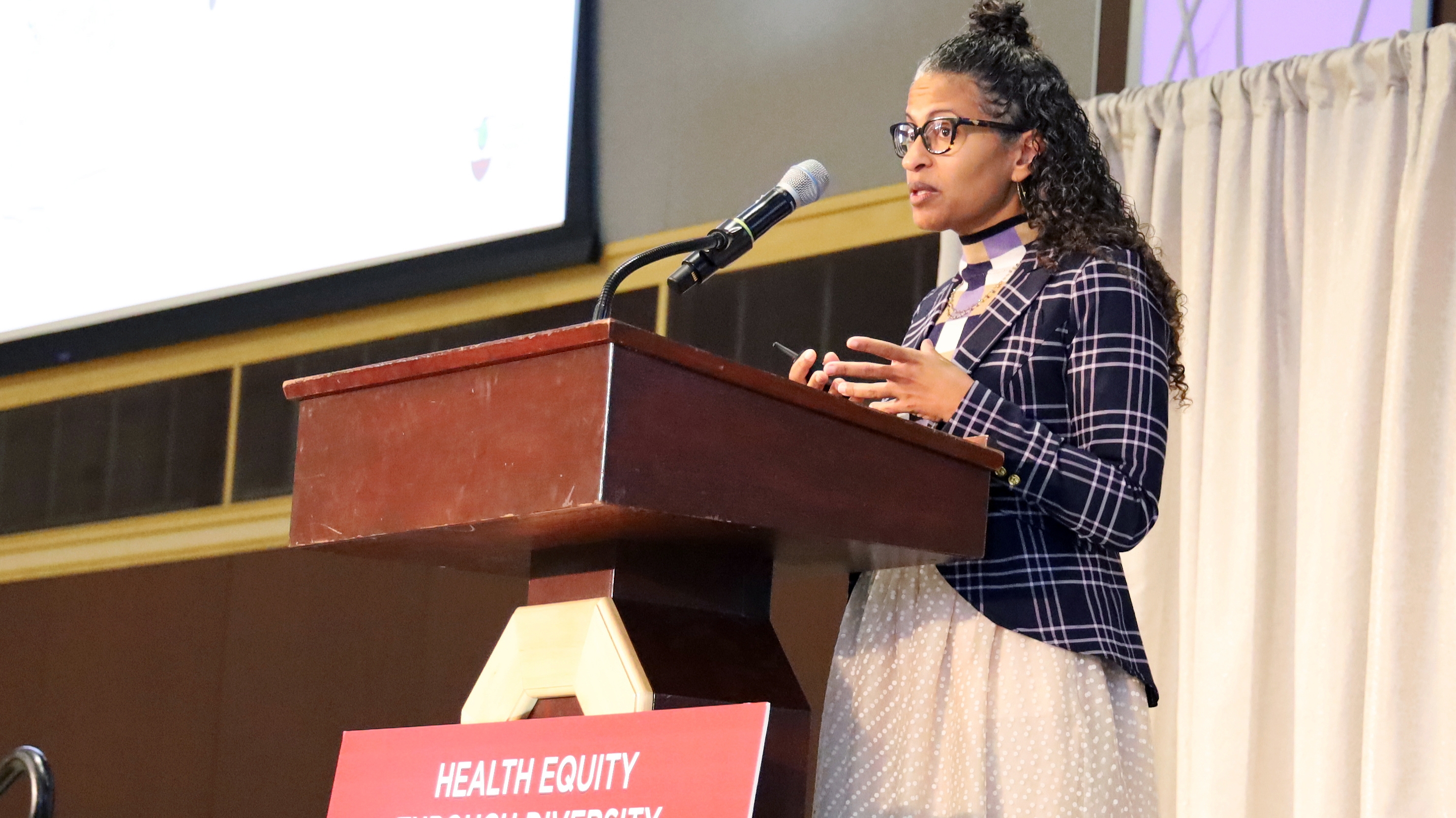 Eugenia South speaks behind a lectern
