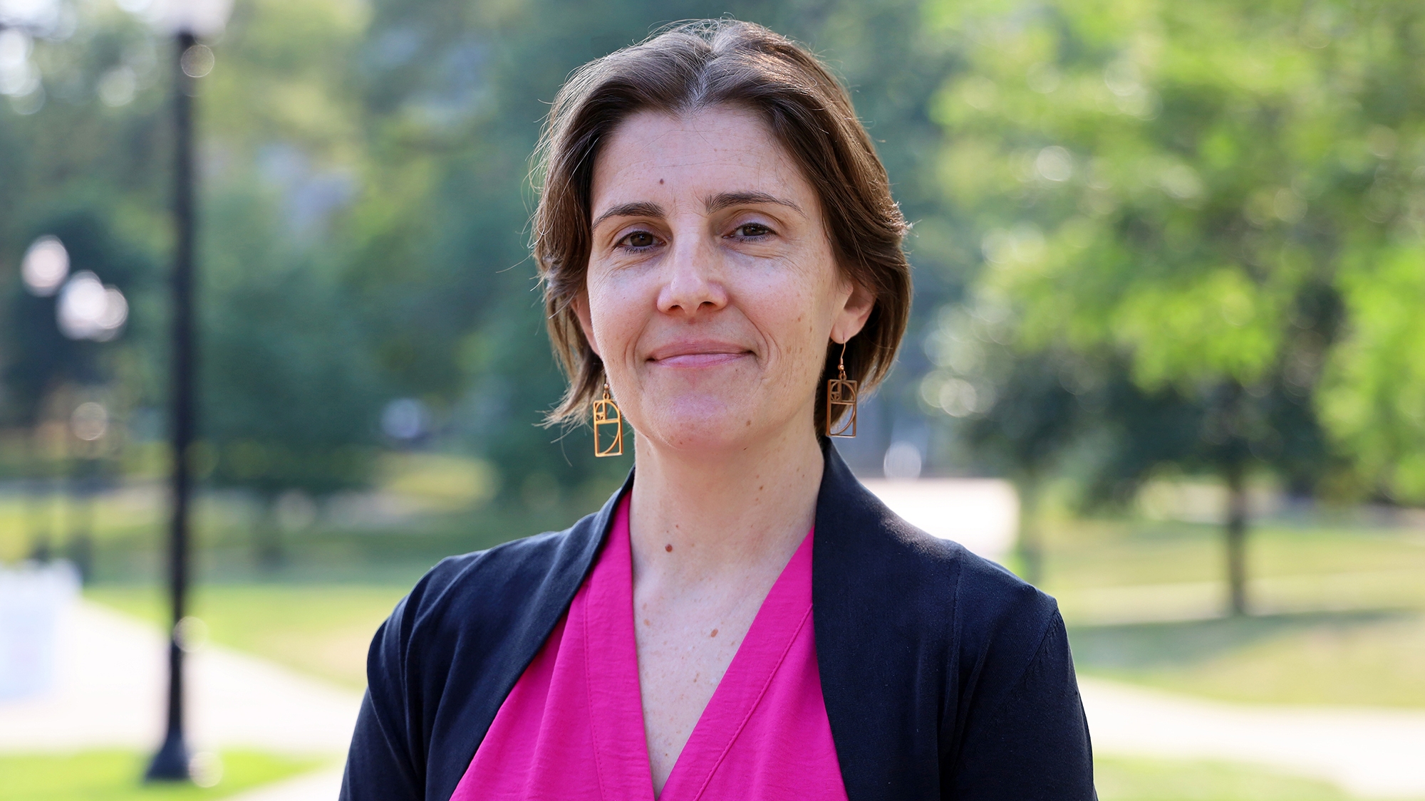 Rebecca Andridge standing outside on campus