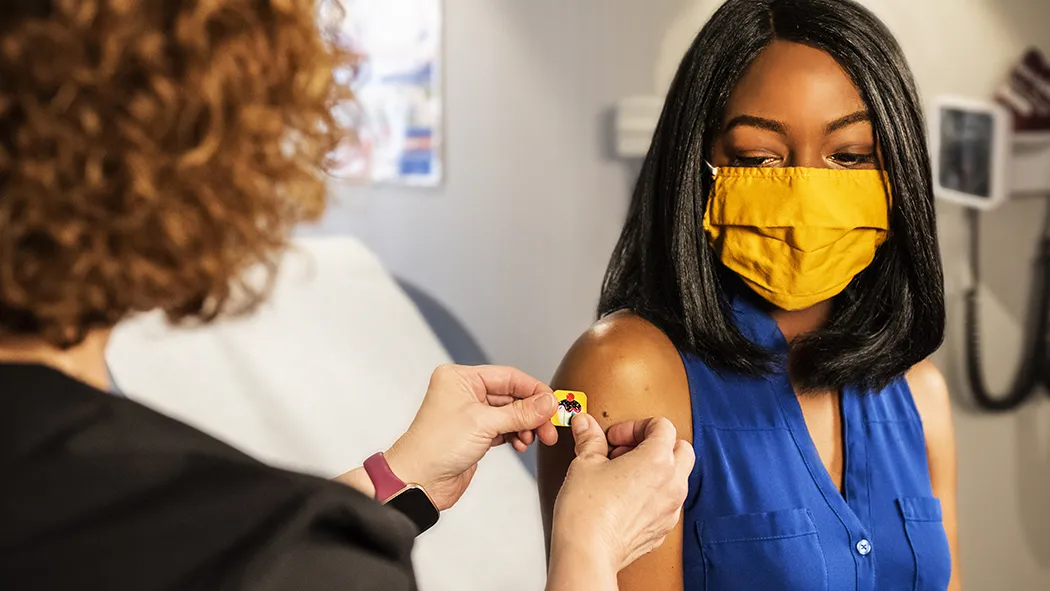 Woman receiving vaccine