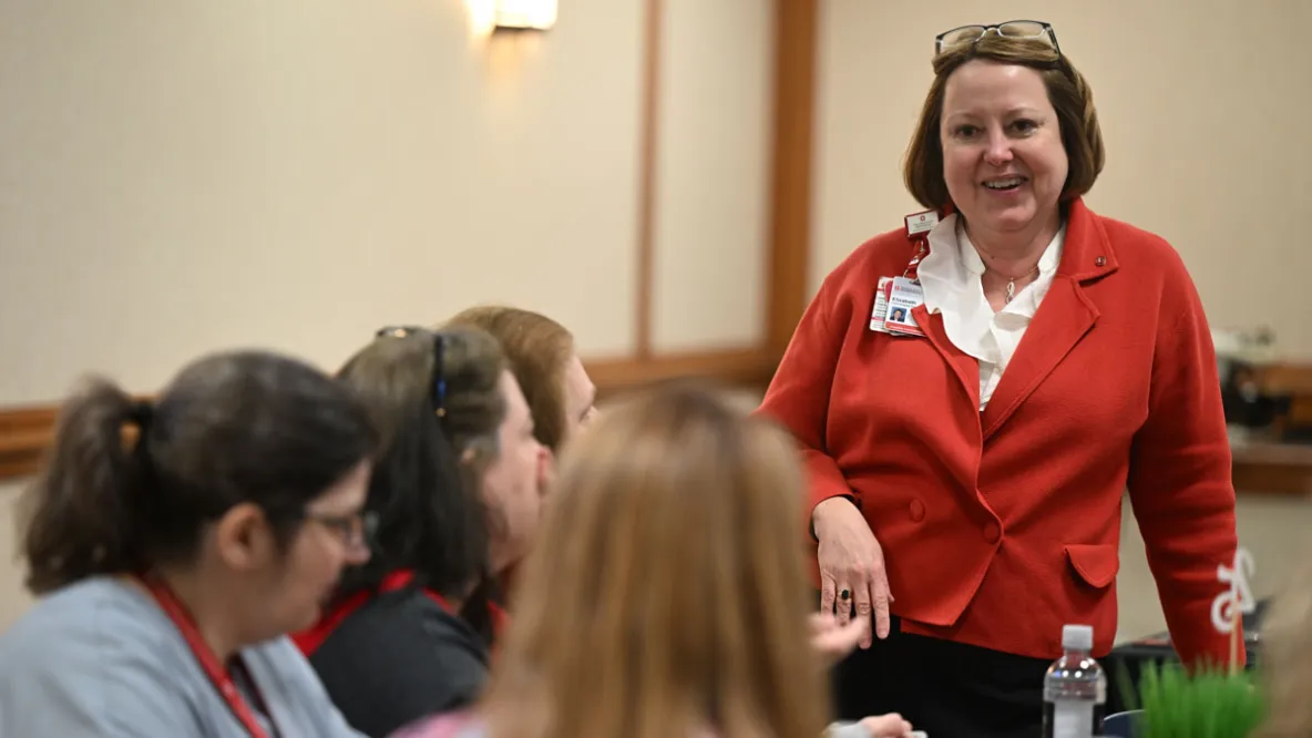 MHA alum Elizabeth Seely, chief administrative officer for the Ohio State Health System's Hospital Division, speaks to a group of people at a leadership summit.